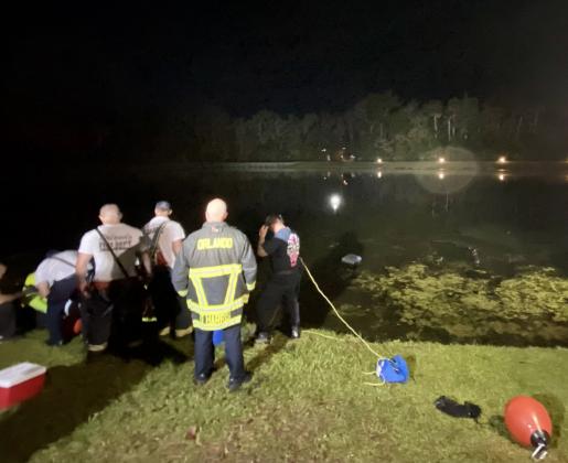 Orlando Fire Department dive team works to recover a vehicle that went into the pond at World Drive and Celebration Boulevard. PHOTO/OSCEOLA FIRE RESCUE EMS
