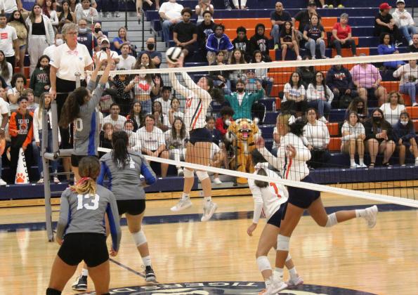 Tohopekaliga's Danna Aguilera (13 in white) goes up against Osceola's Kaitlyn Taylor Wednesday in the 7A-5 volleyball semifinal. PHOTO/KEN JACKSON