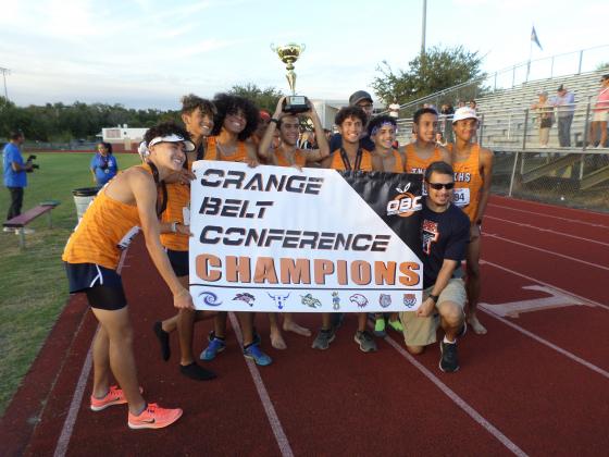Tohopekaliga's boys celebrate the school's first OBC cross county title, won Wednesday in a tiebreaker over Celebration