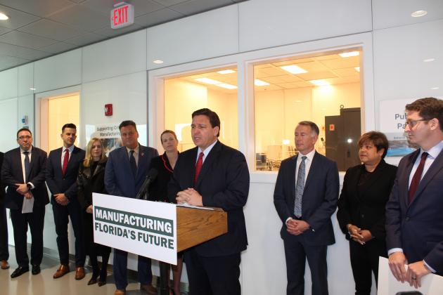 Gov. Ron DeSantis presents grants for a pair of NeoCity-based projects Wednesday at the Center of Neovation. PHOTO/KEN JACKSON