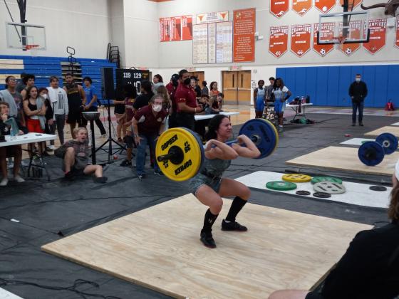 Harmony’s Adriana Rosa gets ready to complete her 190-pound effort In the clean and jerk at Friday's OBC Championships at Harmony High School. PHOTO/DAN PEARSON