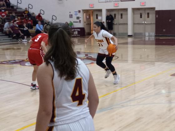 Danigzy Mantilla (23) starts to drive the lane against Emily Shook (3) during St. Cloud’s 52-33 regional quarterfinal win Thursday night. PHOTO/DAN PEARSON
