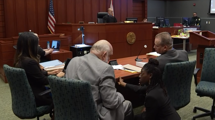 Anthony Todt (right) has a discussion with defense attorneys Alisha Smith and Robert Wesley during his murder trial Tuesday at the Osceola County Courthouse. PHOTO/NINTH DISTRICT