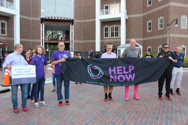 A parade of males walked “A mile in her shoes” during the April 27 St. Cloud Monthly Market downtown to bring awareness to domestic and sexual violence. PHOTO/KEN JACKSON