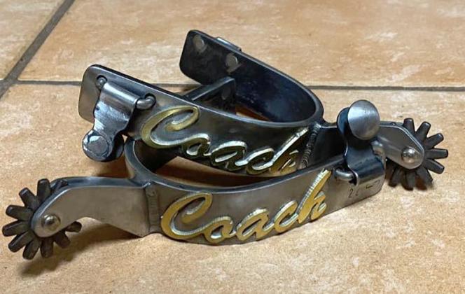 A set of spurs adorned with the word “Coach,” one of her retirement presents. SUBMITTED PHOTO