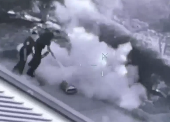 Video from a Sheriff's helicopter shows deputies using a fire extinguisher to put out flames on Jean Barreto at an Orange County Wawa in a Feb. 27, 2022 incident. PHOTO/OSCEOLA CO. SHERIFF'S OFFICE
