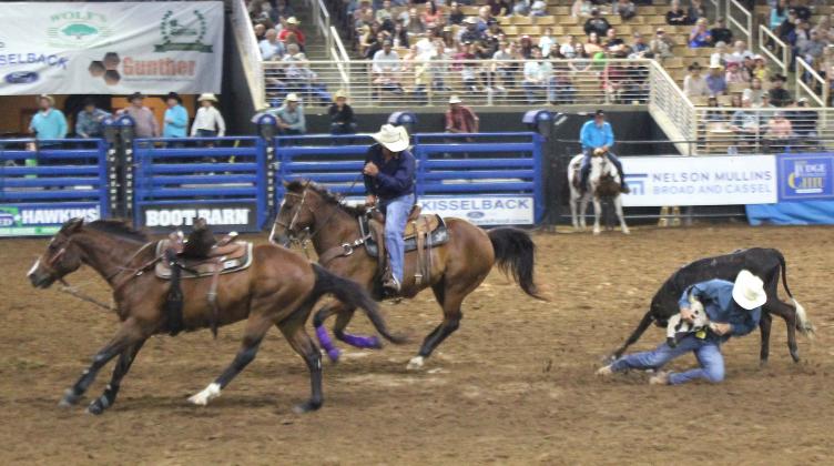 Steer wrestler Bud Hallman needed just 7.9 seconds Friday night to take down his nemesis. PHOTO/KEN JACKSON