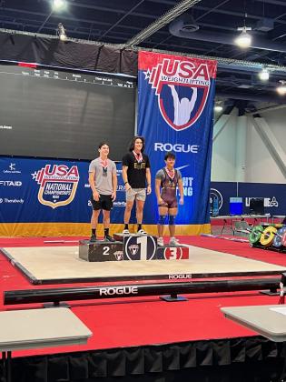 St. Cloud’s Julian Sykes (right) was a bronze medalist in the 160-pound class at the USA National Weightlifting Championships in Las Vegas last week.