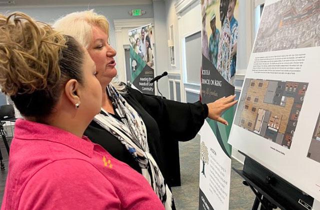 Osceola Council on Aging CEO and County Commissioner Viviana Janer look over the plans for Buen Vecino, a 60-unit senior affordable housing project to be built in 2023. PHOTO/OCOA