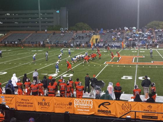 Osceola's defense (white) forced three turnovers but Lakeland (3-0) rushed for four touchdowns in a 25-22 win over the Kowboys. PHOTO/J. DANIEL PEARSON