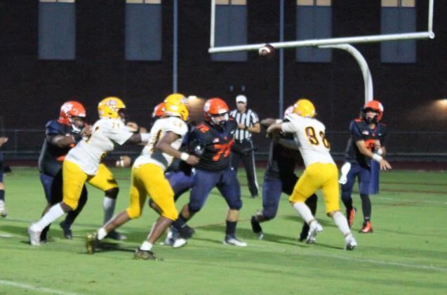 Tohopekaliga quarterback (right) throws a pass in Friday's 47-6 win over St. Cloud. PHOTO/KEN JACKSON