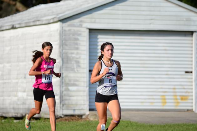 Celebration's Catalina Edwards (right) will be a favorite in the girls individual race at Wednesday's Orange Belt Conference cross country meet. FILE PHOTO