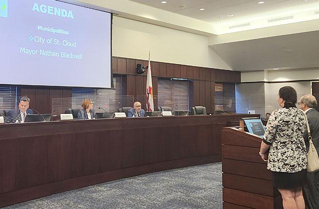 St. Cloud Mayor and City Manager Nathan Blackwell and Veronica Miller present their legislative priorities Thursday during the Osceola Legislative Delegation annual public meeting. PHOTO/KEN JACKSON