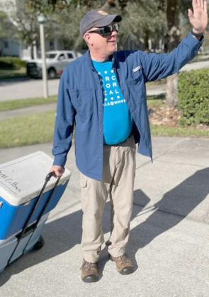 David Collins makes a Meals on Wheels delivery, as he as volunteered to do for years.  PHOTO/OSCEOLA COUNCIL ON AGING