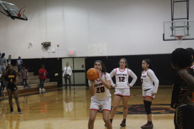 Malayna Stevenson shoots one of her 17 free throws -- all makes -- in Gateway's 51-34 district championship win over Jones. PHOTO/KEN JACKSON
