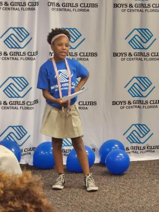 Ten-year-old Araeyai Wilder reads an impact statement of why she loves the St. Cloud Boys & Girls Club at Friday’s official opening ceremony. PHOTO/KEN JACKSON