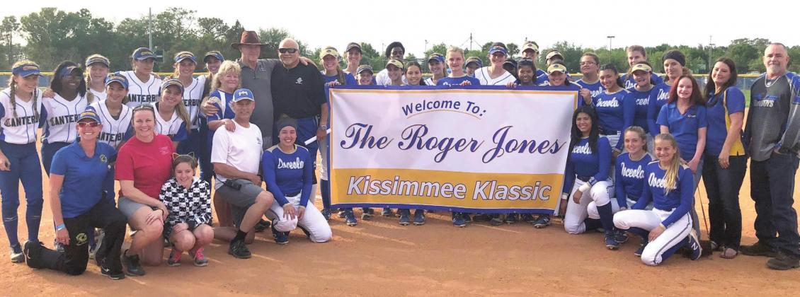 The Kissimmee Klassic softball tournament was re-named in honor of Roger Jones (in hat standing to left of banner) in 2018 prior to his passing away later that year. The showcase tournament begins Thursday at the Fortune Road softball complex. PHOTO/OSCEOLA H.S.