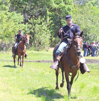 Yankee cavalry were on the move in this photo from the 2022 Battle of Narcoossee Mill re-enactment. PHOTO/TERRY LLOYD