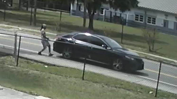 A suspect is caught on surveillance video getting into getaway car on surveillance Saturday near where a body was found. PHOTO/KISSIMMEE P.D.