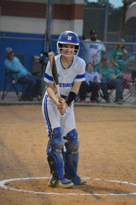 Catcher Natalie Booth brings a big bat at the plate when she's not catching behind it for the Harmony Longhorns. PHOTO/HARMONY H.S.