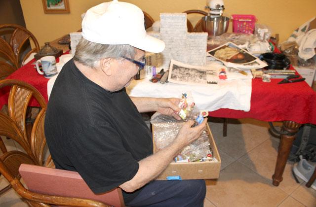 St. Cloud’s Vince Vallone sorts out vintage Nativity figurines donated by family and friends. PHOTO/TERRY LLOYD