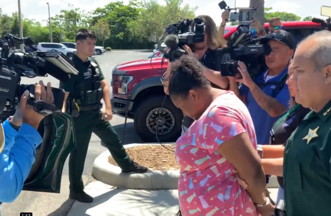 Rachelle Edwards, accused of sexual relations with a juvenile at a detention center she worked at, is led to jail Tuesday. PHOTO/OSCEOLA CO. SHERIFF’S OFFICE