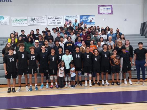 Sitting in the front rows, the Celebration Boys Volleyball team poses with their fans after Tuesday’s regional championship win over Horizon. The Storm will face second-seeded Winter Park on Friday in an FHSAA state quarterfinal game. PHOTO/J. DANIEL PEARSON