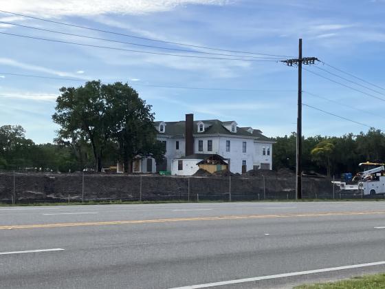 How the Ivey House looks today, from across Orange Blossom Trail, as crews work to dig retention ponds and grade part of the land for potential commercial development. PHOTO/TERRY LLOYD