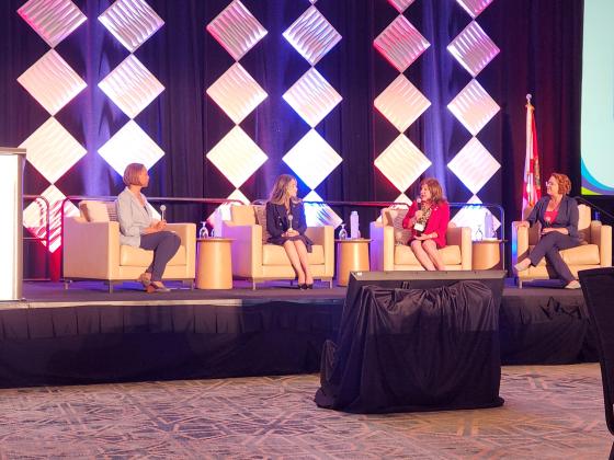 Walt Disney World Government Affairs Manager Leticia Adams (left) speaks with Osceola County state representatives Carolina Amesty, Paula Stark and Kristen Arrington at Wednesday's Osceola Chamber Legislative Update. PHOTO/KEN JACKSON