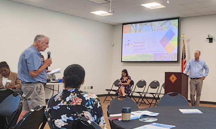 Poinciana residents ask questions of Central Florida Expressway Authority representatives Tuesday at a public meeting about the proposed Southport Connector toll road along Cypress Parkway. PHOTO/KEN JACKSON