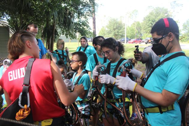Children in danger of losing their sight recently got the chance to improve their mobility — and confidence — during a recent excursion to Orlando Tree Trek Adventure Park, north of Reunion. PHOTOS/LIGHTHOUSE 