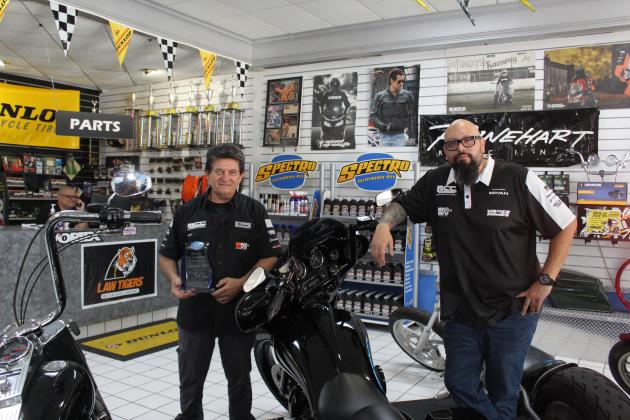 Brian Dady (left) and Bryan Montoya keep The Motorcycle Clinic in Kissimmee rolling. The business was honored for 50 years of service with the city’s Ruby Award. PHOTO/KEN JACKSON