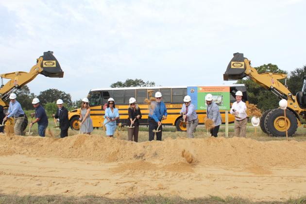 Osceola County School District officials and transportation employees broke ground Tuesday on the site of its new St. Cloud facility on Nova Road. PHOTO/KEN JACKSON