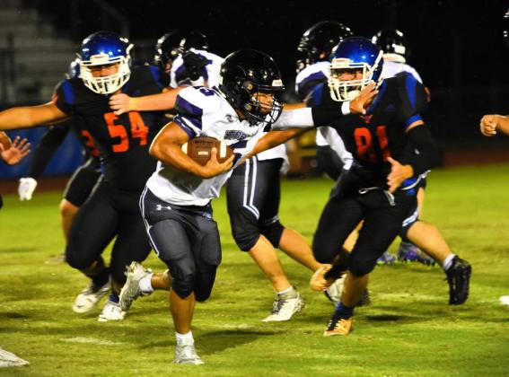 Harmony defender Dalton Carlson closes in on Celebration's Lucas Morton-Carlson in Friday's 41-0 Harmony victory. PHOTO/KATIE WILLIAMS