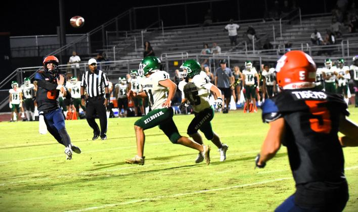 Tohopekaliga quarterback Sabby Meassick tries to connect on a pass with receiver Julian Nasco in Friday's 31-24 overtime loss to Melbourne. PHOTO/KATE WILLIAMS