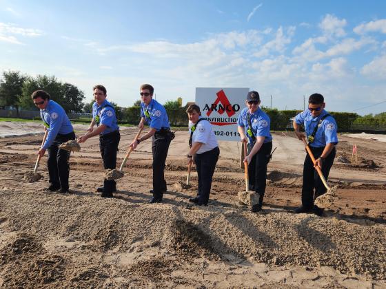 The future rescue staff of St. Cloud Fire Department Station 34 take part in Friday’s ceremonial groundbreaking. PHOTO/KEN JACKSON