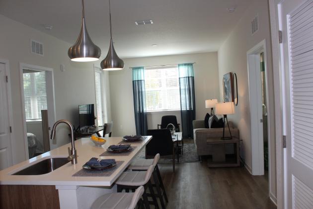 A “leap of faith” resulted in a multi-story condo complex with rents from $1,500-1,700 for units of 600-900 square feet, including utilities and amenities like the fitness center use of lockers for food deliveries. PHOTO/KEN JACKSON