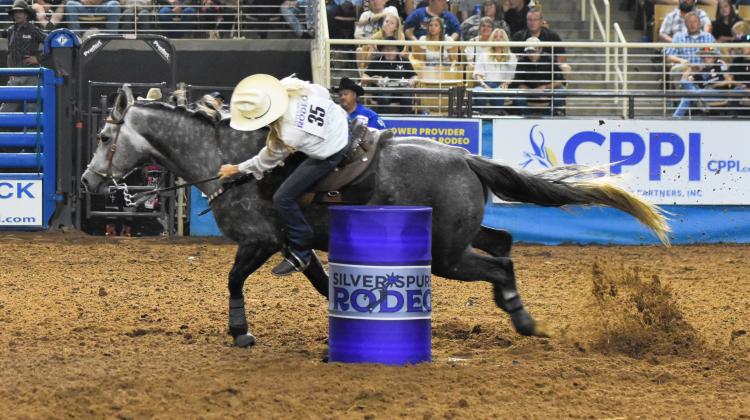 The barrel racers' mantra: Ride fast, don't tip a barrel, keep your hat on.  PHOTOS BY KATIE WILLIAMS