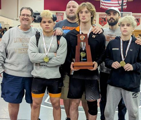 Surrounded by Head Coach Vic Lorenzano and his assistant coaches, Harmony had three regional champions (from left) Shawn McCallister, John Fernandez and Nathan Lytle. PHOTO/HARMONY HIGH SCHOOL