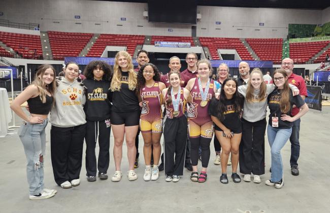 Led by state champions Ashley Aun (center) and Reese Butler (right center), the St. Cloud High girls weightlifting team had top 10 team finishes at FHSAA Class 3A State Championships at Lakeland Saturday. PHOTO/ST. CLOUD HIGH SCHOOL