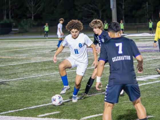 Osceola's Jose Marcano works through the Celebration defense. PHOTO/MARIO CASAMALHUAPA