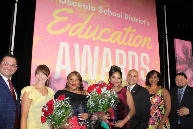 Osceola Technical College Medical Assistant Instructor Vanessa Gomez (right, with flowers) and Tohopekaliga High School Executive Secretary Dawn Parker have been named this year’s School District of Osceola County Teacher of the Year and School-Related Employee of the Year. PHOTO/KEN JACKSON