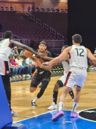 Alex Morales, getting the start with Mac McClung nursing an injury, drives through the Toronto defense Monday. PHOTO/KEN JACKSON