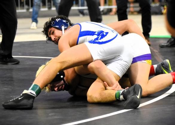 Junior Isfandier Sharipov gave Osceola its first state champion of the night with a stunning 3-2 upset of Southwest Miami’s Dillon Smith in the Class 3A 132-pound final Saturday at the Silver Spurs Arena. PHOTO/KATIE WILLIAMS