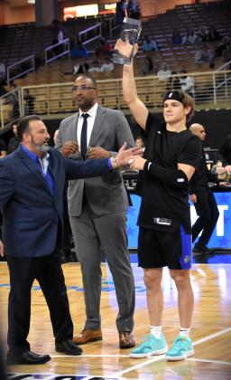 Osceola Magic point guard Mac McClung, also the NBA G League leading scorer in 2023-24 with 25.7 points per game, receives the league's MVP trophy prior to Friday's game. PHOTO/KATIE WILLIAMS