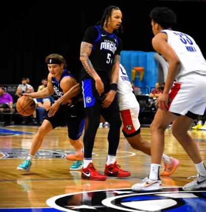 Osceola's Mac McClung rolls off of a D.J. Wilson screen in Friday's NBA G League Eastern Conference quarterfinal game. PHOTO/KATIE WILLIAMS