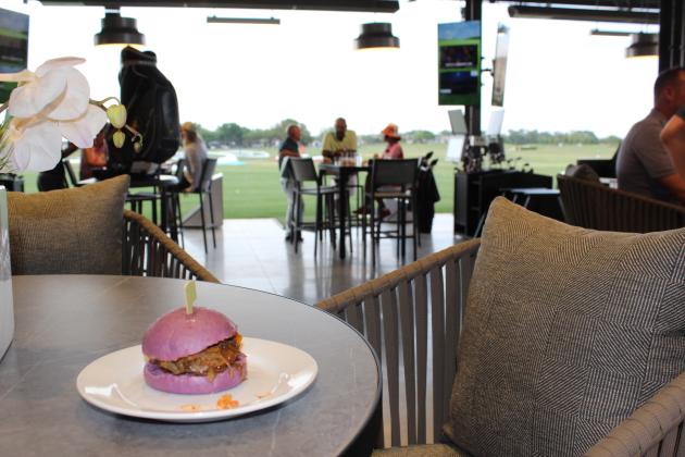 Before, after — or while — you hit some golf balls at Eagles Edge at ChampionsGate, enjoy food options like the sliders (and yes, it's on a purple bun). PHOTO/KEN JACKSON