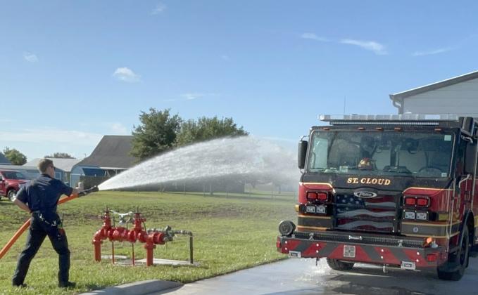 Engine 34 receives a traditional wet-down and is pushed back into its bay. PHOTO/DEBBIE DANIEL