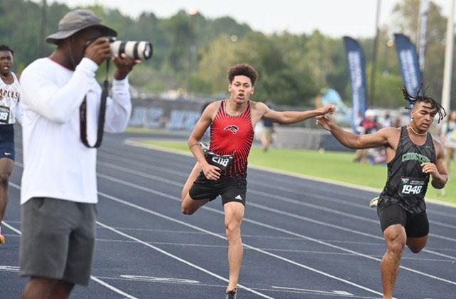 Gateway’s Jose Calderon stretches at the tape in the finals of the Class 4A state meet 400 meter run, where he finished seventh. PHOTO/JULIE ANDREW