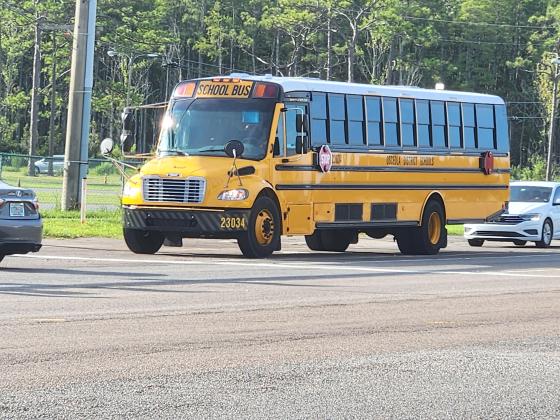 A school bus turns into Osceola School for the Arts Monday morning. All buses and routes had corresponding drivers, the School District's transportation department reported. PHOTO/KEN JACKSON